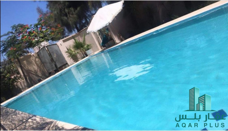 مرزعة للبيع بالطريق الصحراوى 